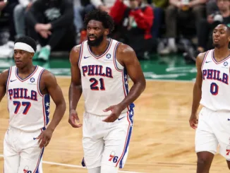 Joel Embiid protects basket during Philadelphia 76ers defensive possession in game