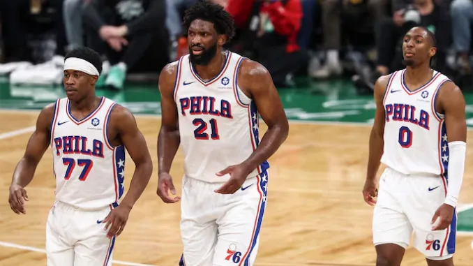 Joel Embiid protects basket during Philadelphia 76ers defensive possession in game