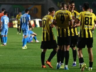Generic football players competing during a UEFA Champions League qualifying match between Kairat Almaty and FK Sutjeska Nikšić.