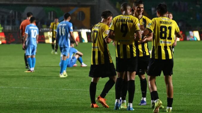 Generic football players competing during a UEFA Champions League qualifying match between Kairat Almaty and FK Sutjeska Nikšić.