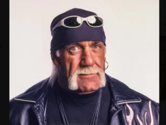 Hulk Hogan celebrating after winning a championship in WWE