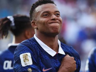 Kylian Mbappé celebrates after becoming the FIFA World Cup all-time leading goal scorer with 22 goals.