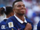 Kylian Mbappé celebrates after becoming the FIFA World Cup all-time leading goal scorer with 22 goals.