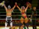 La Hiedra and Laredo Kid celebrate winning AAA Mixed Tag Team titles